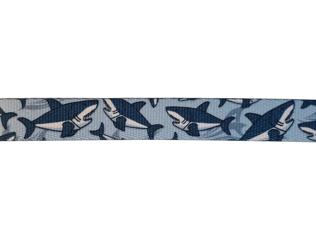 Polyester webbing with shark pattern on a light blue background