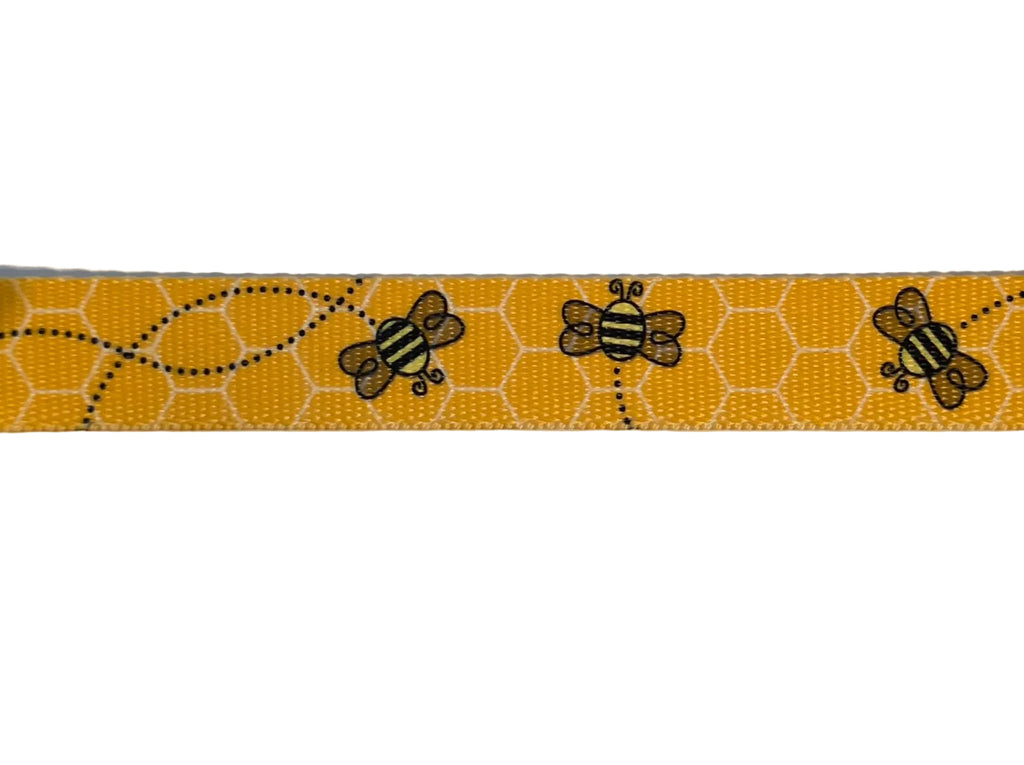Polyester webbing with black honey bee pattern on a yellow with white honeycomb background