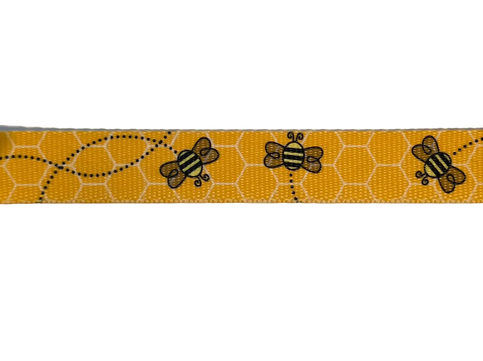 Polyester webbing with black honey bee pattern on a yellow with white honeycomb background