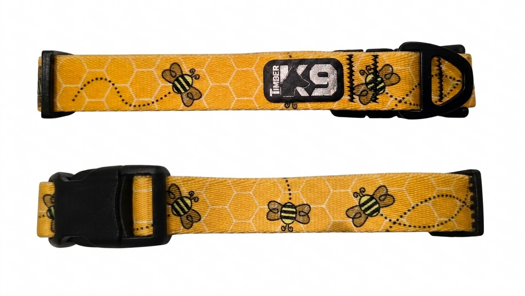 Dog collar made with polyester webbing with bee designs on a yellow background with white honeycomb pattern